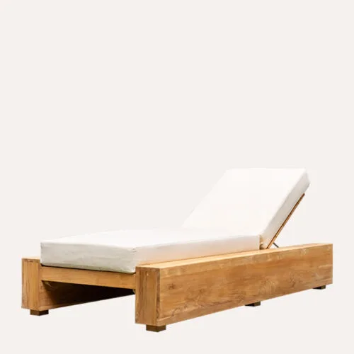 Front angled view of the Permata Furni Arthur Reclaimed Teak Outdoor Chaise Lounge, highlighting its robust reclaimed teak construction and comfortable white cushion, perfect for commercial resorts