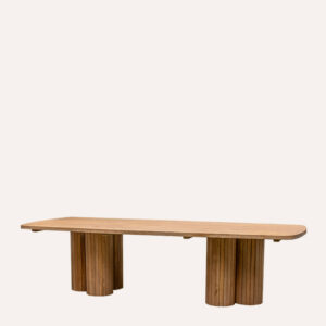 Angled view of the Permata Furni Nexx Reclaimed Teak Rectangular Outdoor Dining Table, highlighting the FSC-certified reclaimed wood and the distinctive design of its fluted legs, suitable for B2B hospitality projects
