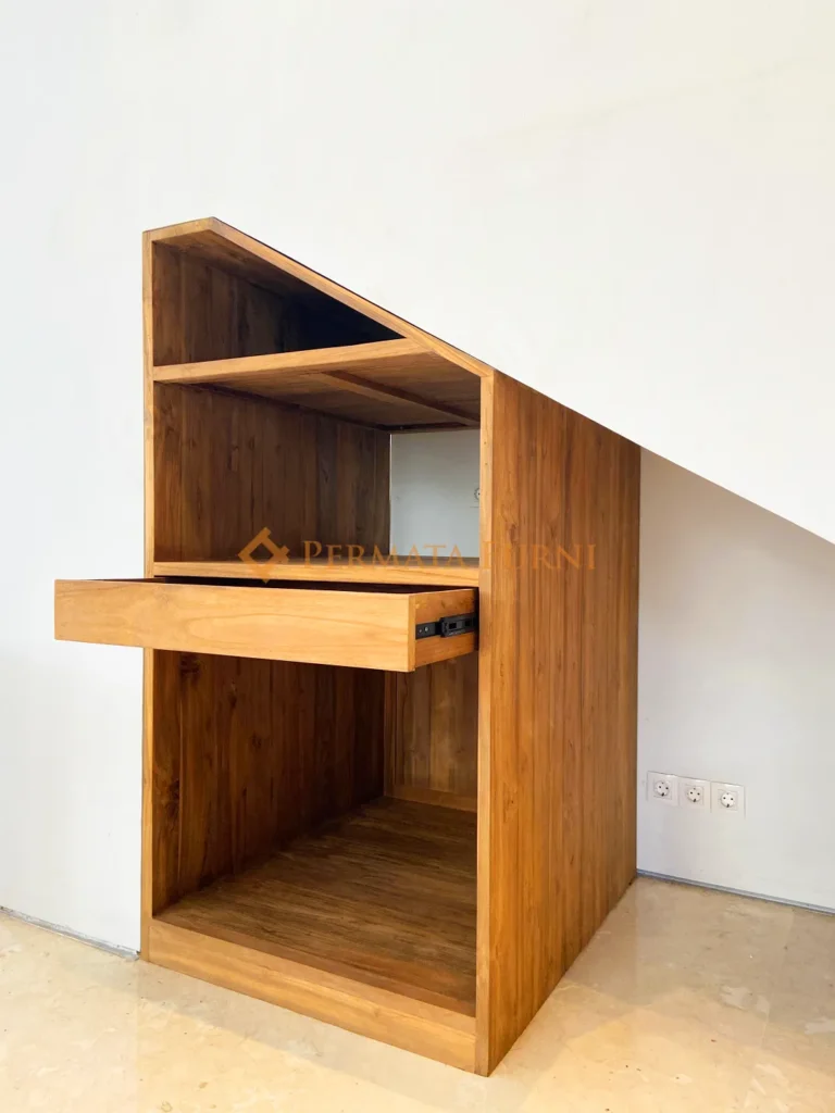 Custom-built modern minimalist cabinet made from recycled teak wood, designed to fit under stairs at AA House in Cinere Depok