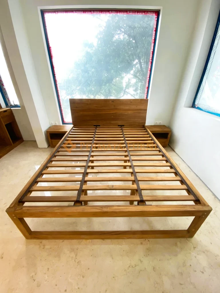 Modern minimalist bed frame made from recycled teak wood, featuring a natural finish and clean lines, handcrafted by Permata Furni for AA House in Cinere, Depok