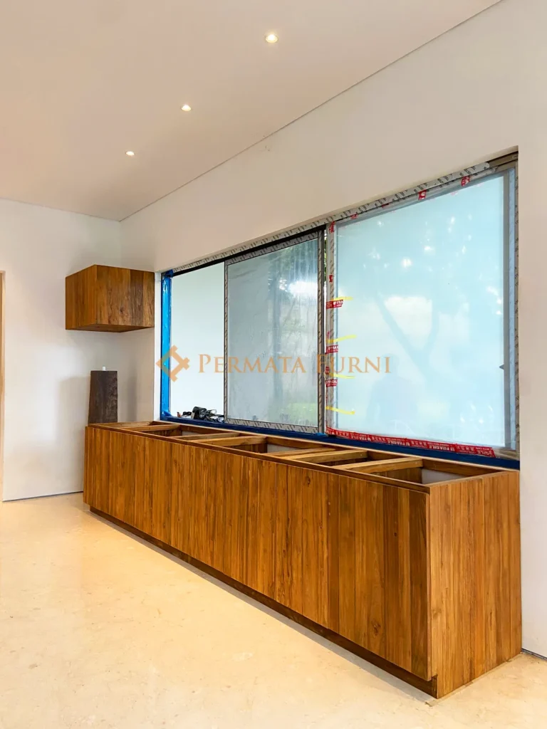 Modern minimalist kitchen cabinet crafted from recycled teak wood at AA House project in Cinere, Depok, 2025