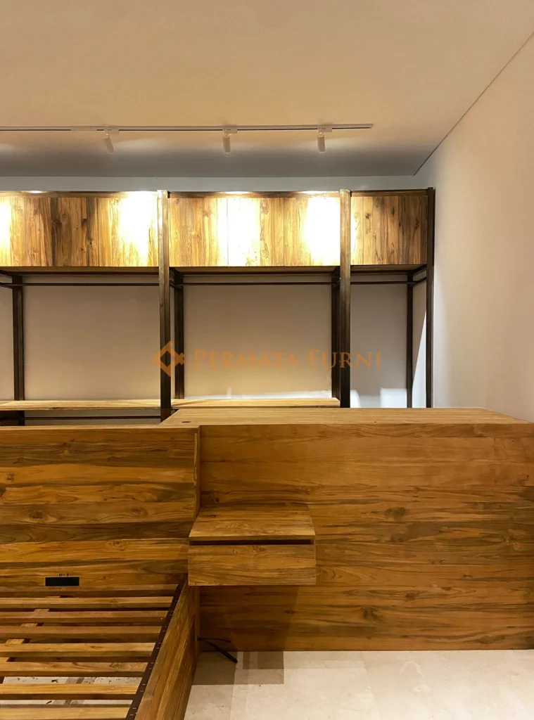 Modern minimalist interior design in Cinere, Depok featuring custom furnishings made from recycled teak wood, including a bed frame and built-in cabinets with warm natural finishes