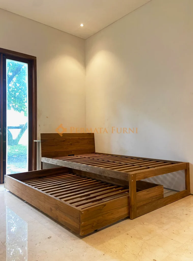 Modern minimalist bed frame with pull-out trundle, crafted from recycled teak wood, featured in Permata Furni’s 2025 Cinere project