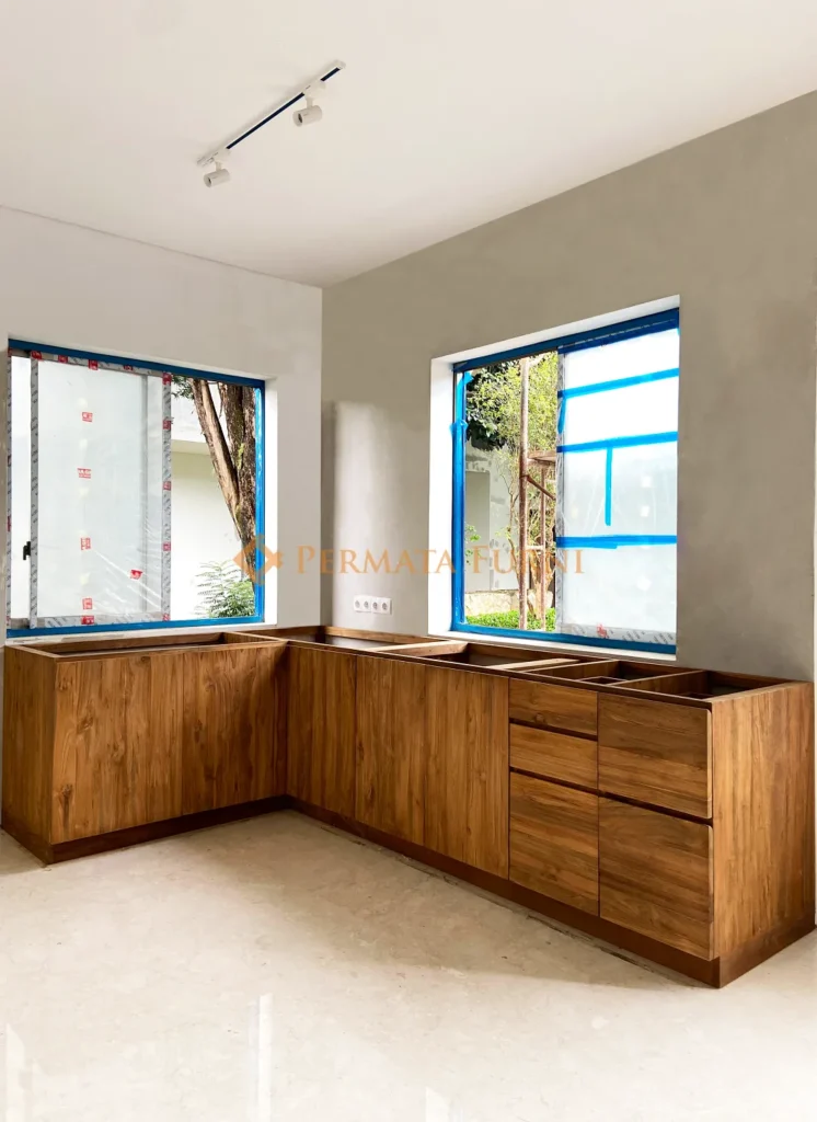 Custom modern kitchen cabinet made from recycled teak wood with minimalist design in AA House, Cinere, Depok