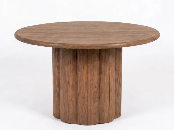 Alila reclaimed teak round dining table with fluted scalloped cylindrical pedestal base and warm honey-brown finish