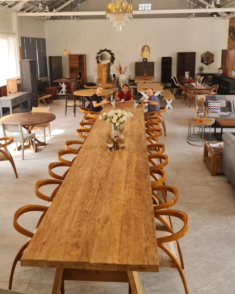 600cm reclaimed teak dining table with bentwood chairs displayed in the RecycleTeak showroom