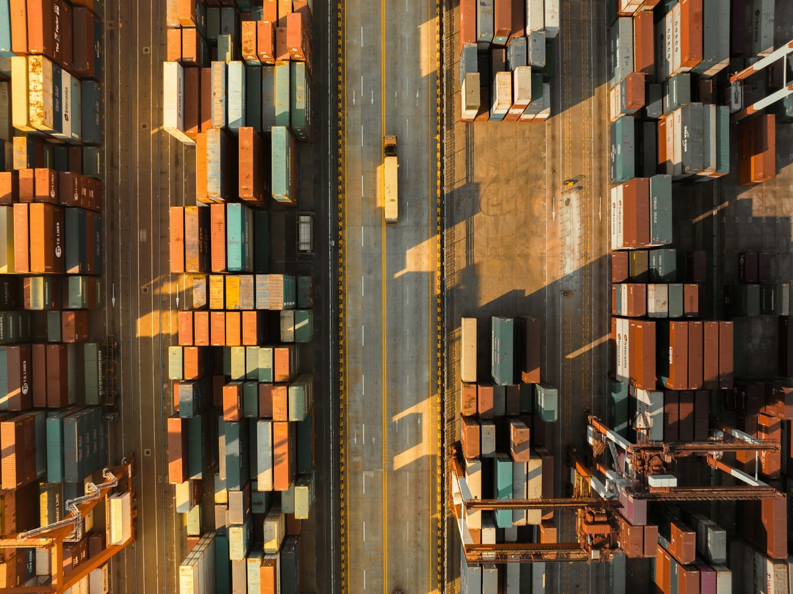 Aerial view of shipping containers at port, representing RecycleTeak's regional export logistics across Asia